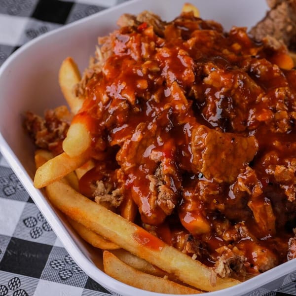 Honey Bear's BBQ fries topped with pulled pork and a generous amount of barbecue sauce.